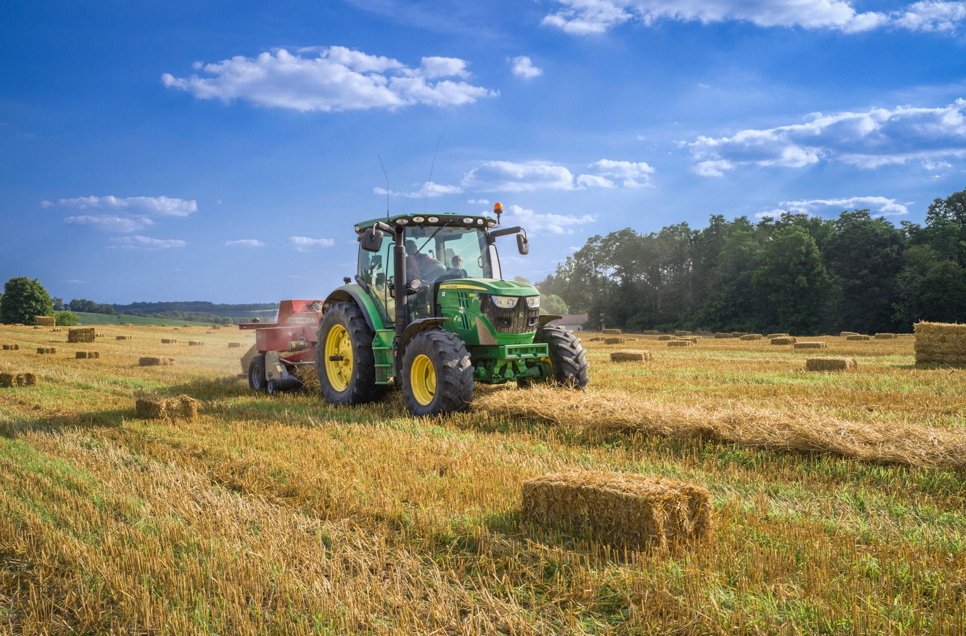 Farmer tending a wheat field at harvest